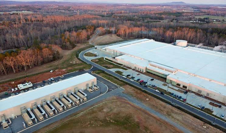 The home of the iCloud: The Apple data center campus in Maiden, North Carolina, featuring a massive 500,000 square foot building (at right) supported by a smaller “strategic” data center using modular data center technology. (Photo: Apple)