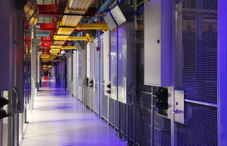 The distinctive blue-lit, cage-lined corridors inside the Equinix DC11 data center in Ashburn, Virginia. (Photo: Equinx)