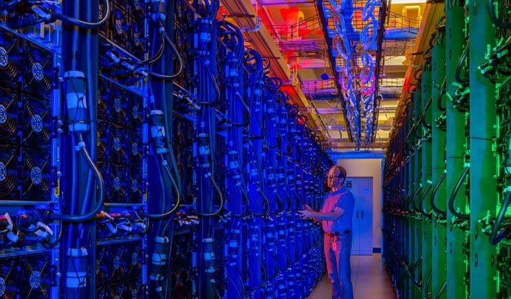 The colorful hot aisle of a high-density enclosure at the Microsoft data center in Boydton, Virginia, which has became a focal point of the company’s cloud development. (Photo: Microsoft Corp.)